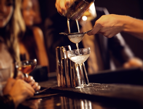 Strangers in Dreams | By Jacob Lund Royalty-free stock photo ID: 132825290 Barman pouring wine from shaker and serving it